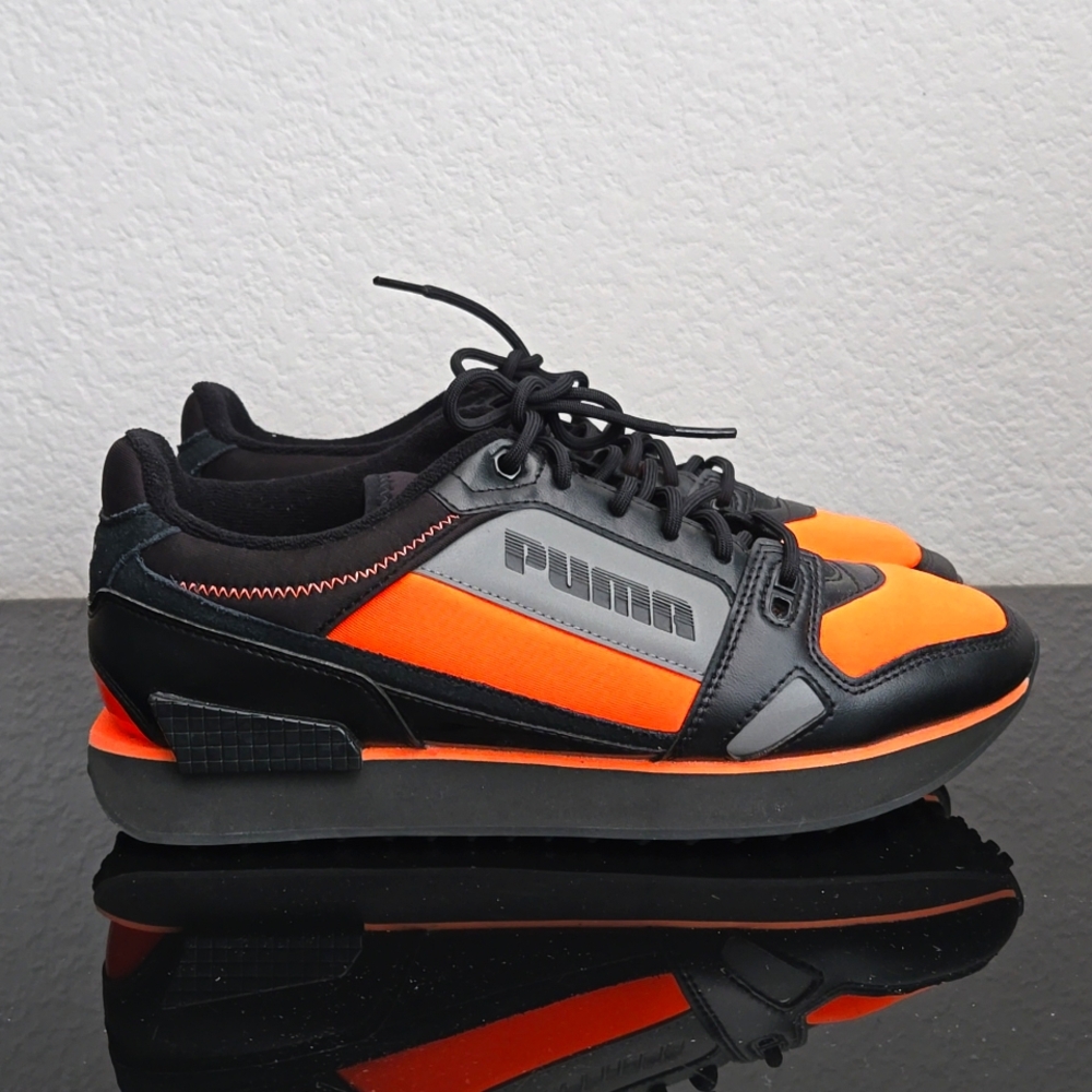 Women's orange and black Puma sneakers